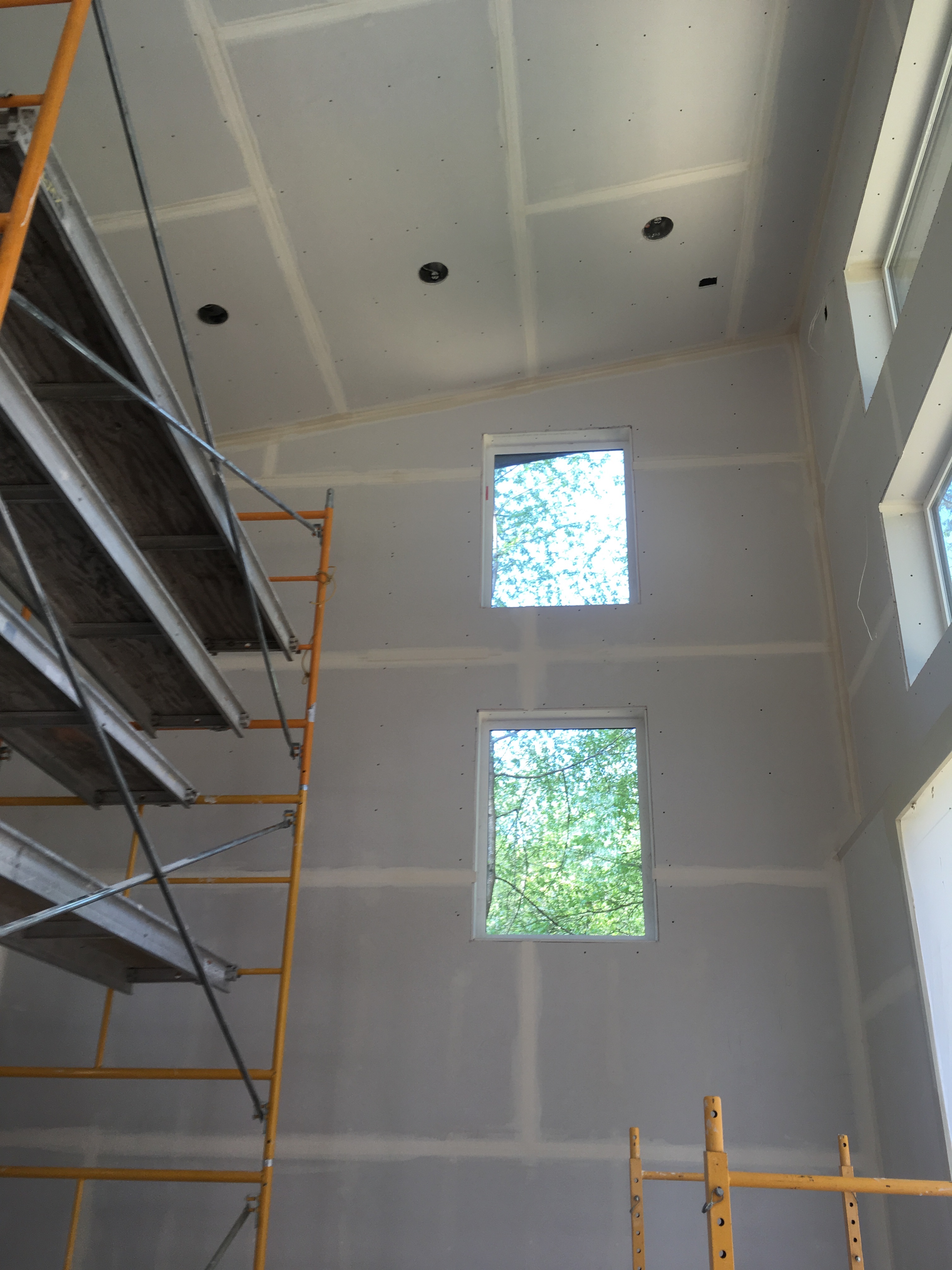 Lake cabin remodel drywall installation and coating in progress Lake cabin remodel drywall installation and coating in progress